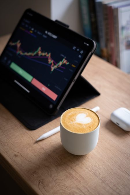 digital-tablet-with-chart-next-to-coffee-cup-2026-01-07-06-39-01-utc-scaled.jpg